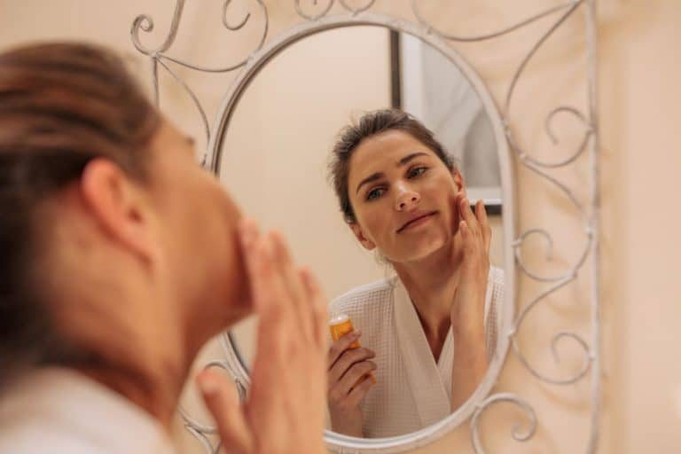 woman applying oil 